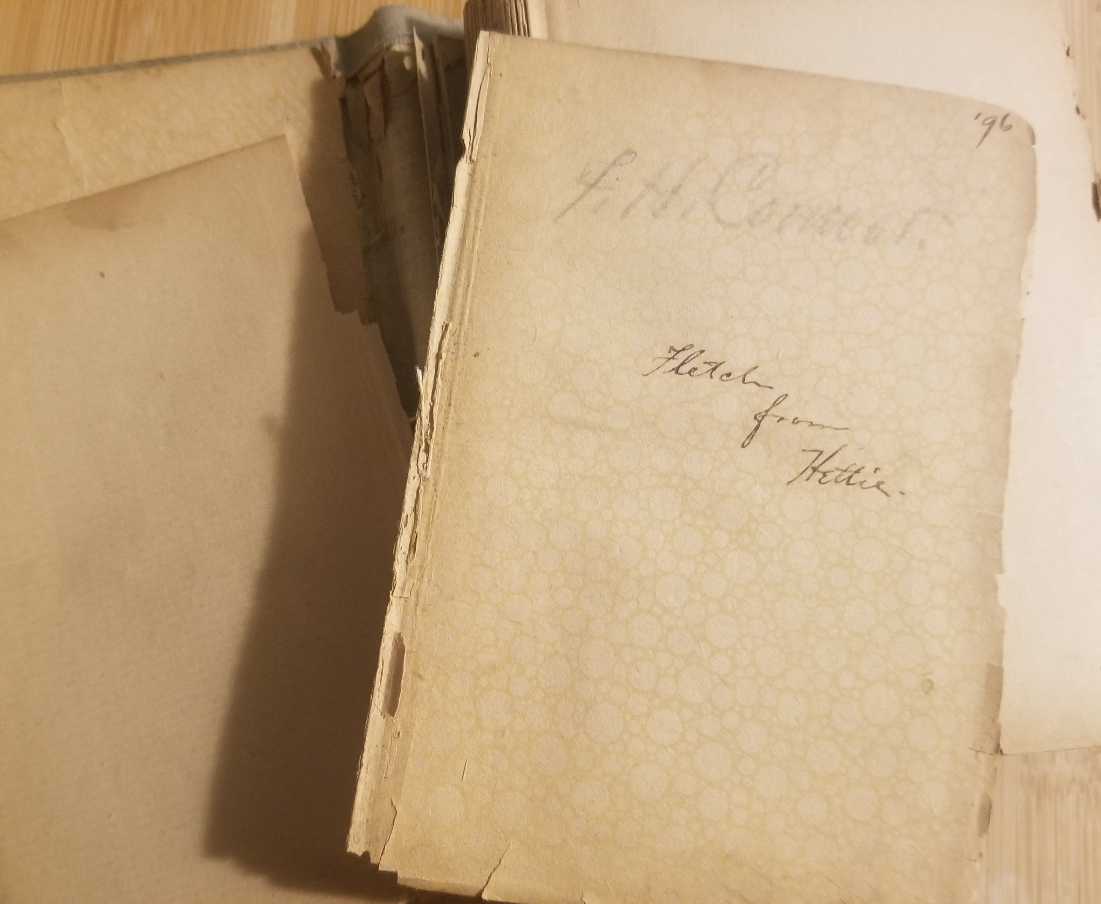 A couple of loose pages from a book, with inscriptions.